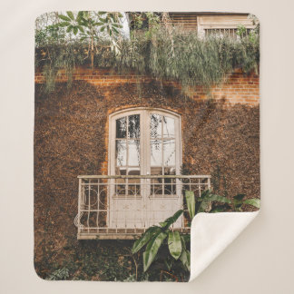 WHITE WOODEN WINDOW FRAME ON BROWN CONCRETE WALL SHERPA BLANKET