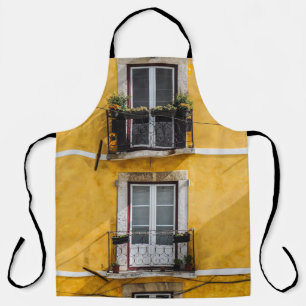 WHITE WOODEN WINDOW PANELS AND YELLOW PAINTED WALL APRON