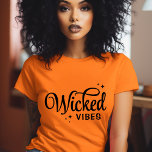 Wicked Vibes Halloween T-Shirt<br><div class="desc">Bring spooky style to your wardrobe with these custom Halloween t-shirts and sweatshirts featuring a trendy retro “Wicked Vibes” text graphic. Personalise with your choice of fonts and colours for a unique look that’s perfect for Halloween parties, trick-or-treating, or casual fall outfits. Available in a variety of sizes and styles...</div>