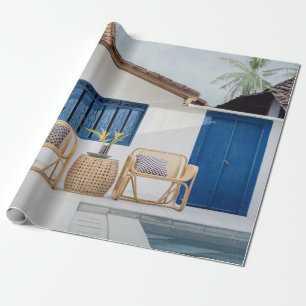 Wicker table and two chairs near swimming pool wrapping paper