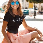 Wifey White Modern Script Black Womens T-Shirt<br><div class="desc">Bold and striking, this black tee features "Wifey" in flowing white script for a standout newlywed look. The white-on-black contrast creates a chic, modern statement perfect for honeymoon travel, date nights, and everyday wife life. A stylish gift for the bride-to-be or new wife. Coordinates beautifully with a matching "Hubby" tee....</div>