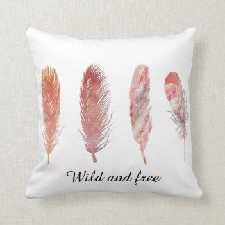 Wild and free pink and peach feathers on white cushion