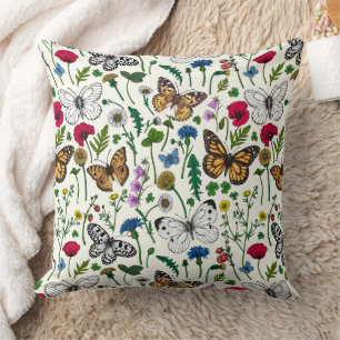 Wild flowers and butterflies on white cushion