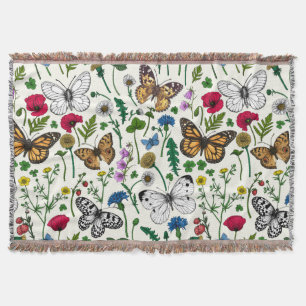 Wild flowers and butterflies on white throw blanket