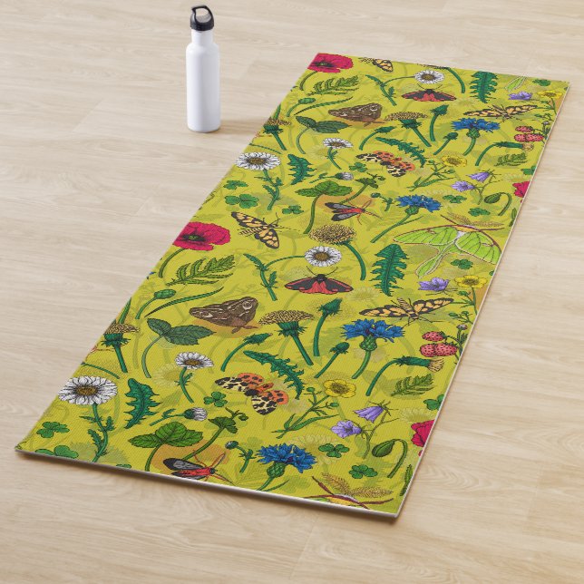 Wild flowers and moths on green yoga mat (In Situ)