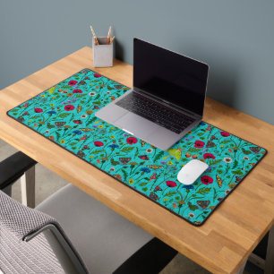 Wild flowers and moths on teal desk mat