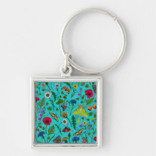 Wild flowers and moths on teal key ring