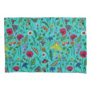 Wild flowers and moths on teal pillowcase
