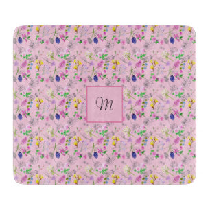 Wild flowers in watercolour, on pink. Monogram Cutting Board