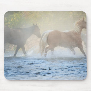 Wild horses running through water mouse mat