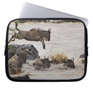 Wildebeest jumping into Mara River Laptop Sleeve