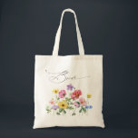 Wildflower Rustic Chic Floral Boho Country Wedding Tote Bag<br><div class="desc">Celebrate your love story with this elegant floral bride tote bag featuring a charming watercolor wild flower design and modern calligraphy script. Perfect for a garden wedding, outdoor ceremony, or rustic boho celebration, this design blends whimsical floral elements with timeless elegance. Ideal for summer or spring weddings, the vibrant botanical...</div>