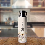 Wildflowers beige custom name script water bottle<br><div class="desc">A beige coloured background. Decorated with wildflowers in yellow and purple.  Personalise and add your name.   Grey handwritten style script.</div>