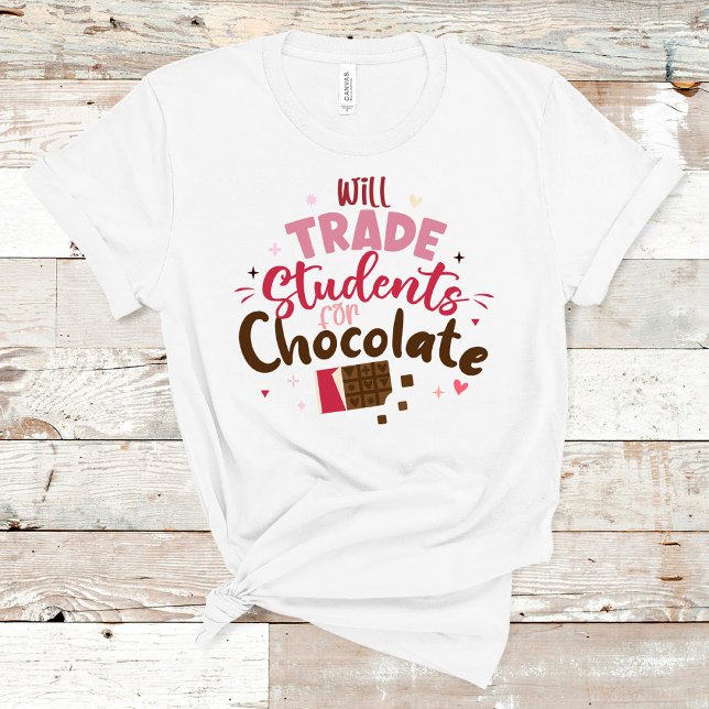 Will Trade Students for Chocolate Funny Valentine  T-Shirt (Will Trade Students for Chocolate Funny Valentine T-Shirt on a wooden table.)