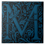 William Morris Blue Monogrammed Letter M Tile<br><div class="desc">Art Nouveau monogrammed tile designs by William Morris are the prefect arts and craft touch to add to your antique fireplace,   
These initial tiles come in all the letters of the alphabet and are the prefect vintage floral.</div>