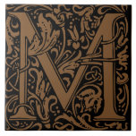 William Morris Gold Monogrammed Letter M Tile<br><div class="desc">Art Nouveau monogrammed tile designs by William Morris are the prefect arts and craft touch to add to your antique fireplace,   
These initial tiles come in all the letters of the alphabet and are the prefect vintage floral.</div>