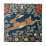 William Morris style Left Facing Running Hare Tile<br><div class="desc">"country classic art nouveau",  "leaping running brown hare rabbit",  "sage green woodland animals",  "british william morris ceramic tile",  "leafy woods dark navy blue",  "forest tree leaf leaves antique",  "vintage coral red wildflowers",  "wildlife english garden animal",  "nature floral flower botanical",  "left facing traditional flowers"</div>