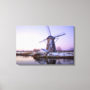 Windmill during sunrise, Holland in winter canvas Print