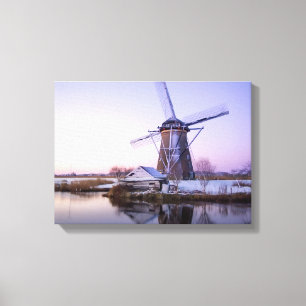 Windmill during sunrise, Holland in winter canvas Print