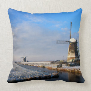 Windmill in the snow in a dutch winter landscape cushion