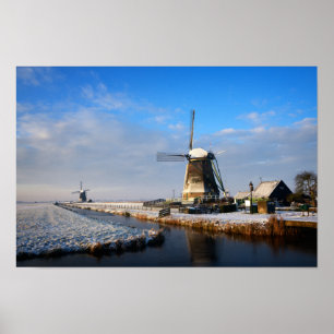 Windmill in the snow in a dutch winter landscape poster