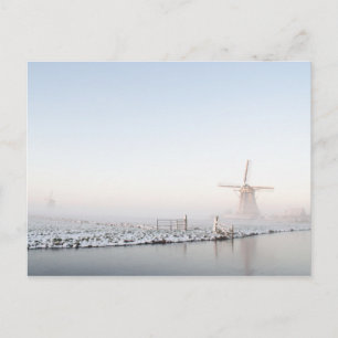 Windmill in the snow in winter postcard