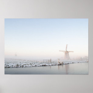Windmill in the snow in winter poster