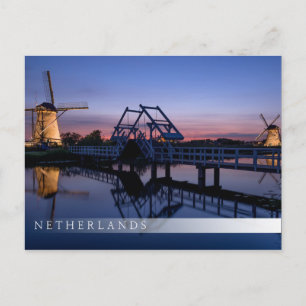 Windmills and a drawbridge at sunset bar postcard