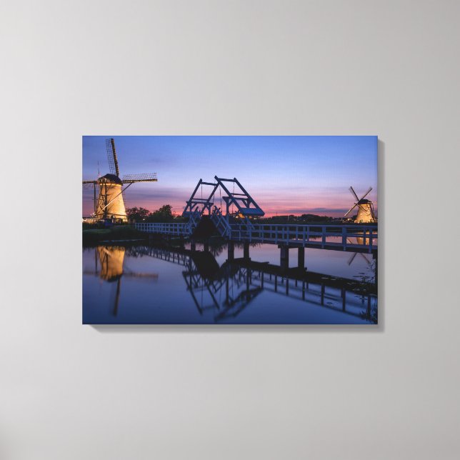 Windmills and a drawbridge at sunset canvas print (Front)