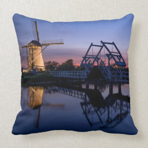 Windmills and a drawbridge at sunset pillow