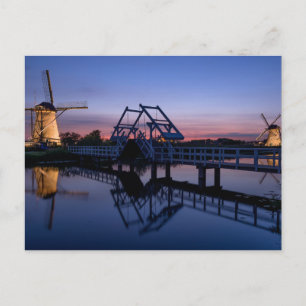 Windmills and a drawbridge at sunset postcard