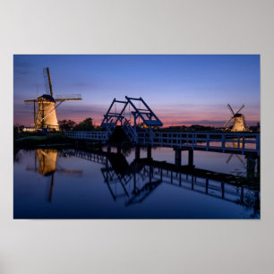 Windmills and a drawbridge at sunset poster