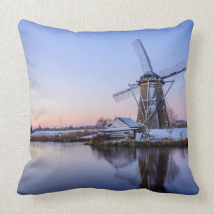 Windmills during a sunrise in Holland throw pillow