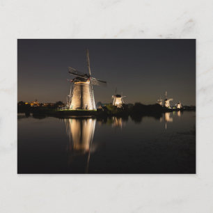 Windmills illuminated at night postcard