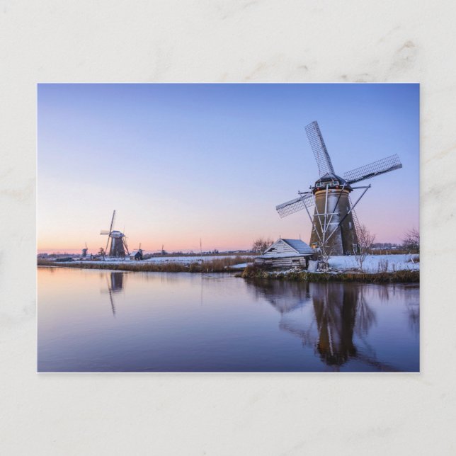 Windmills in winter along a frozen river postcard (Front)