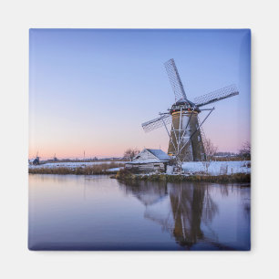 Windmills in winter during a sunrise square magnet