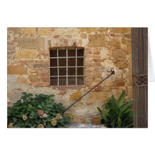 Window and ancient stone wall, Pienza, Italy
