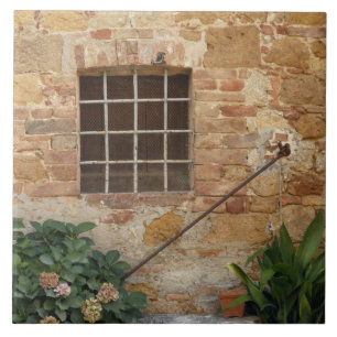 Window and ancient stone wall, Pienza, Italy Tile
