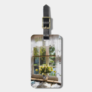 Window with lace curtain and tulips luggage tag