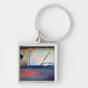 Windshield of an old rusty truck key ring