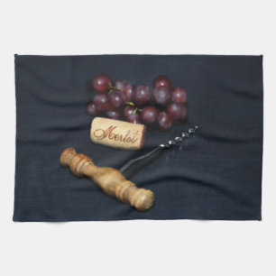 Wine bottle corks, corkscrew and grapes tea towel