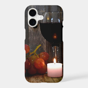 wine glass and candle with grapes