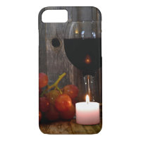 wine glass and candle with grapes