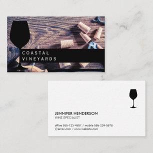 Wine Glass   Wine corks on wooden table Business Card