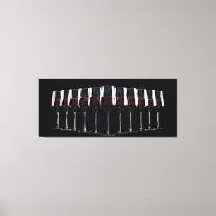 Wine glasses with red wine lined up in a row canvas print