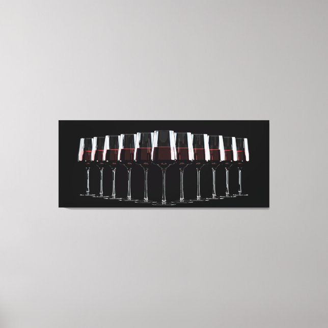 Wine glasses with red wine lined up in a row canvas print (Front)
