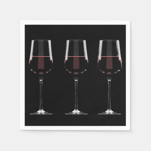 Wine glasses with red wine on black napkin