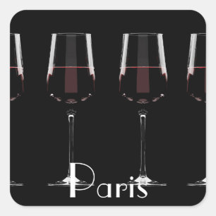 Wine glasses with red wine on black square sticker