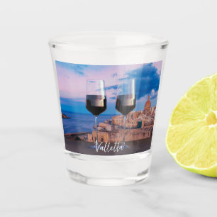 Wine glasses with view of sunset over Valletta