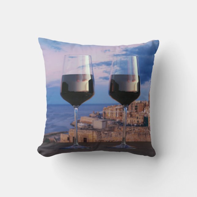 Wine glasses with view of sunset over Valletta Cushion (Front)